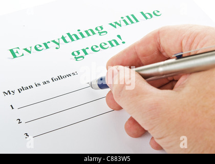 Mano d'uomo con una penna stilografica sul piano 'tutto sarà verde !" Foto Stock