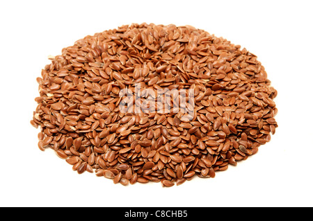 Brown flax seeds on a white background Foto Stock