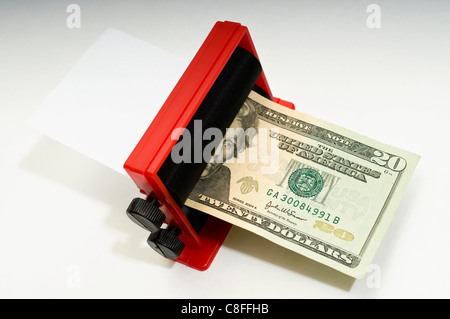 Il vostro denaro privato stampante al lavoro. Foto Stock
