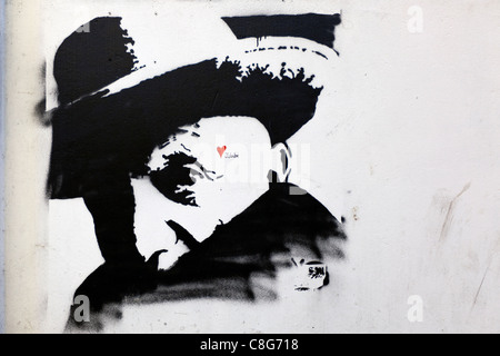 Stencil Street Art da Jubabe dipinta su un muro in Jerome Street, Tower Hamlets, Londra, Inghilterra, Regno Unito. Foto Stock