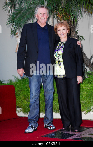 Gary Busey, Maria Elena Holly alla cerimonia di induzione per la stella sulla Hollywood Walk of Fame Cerimonia di Buddy Holly, Foto Stock