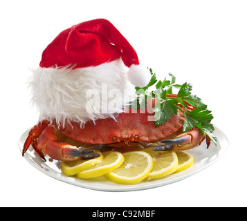 Il granchio in Santa Claus hat su un vassoio Foto Stock