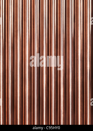 Plumbing lucido di tubi di rame abstract background artistico Foto Stock