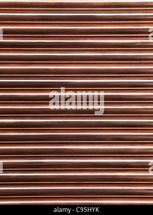 Plumbing lucido di tubi di rame abstract background artistico Foto Stock