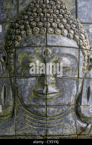 Scolpito in pietra di Buddha pannello di parete Foto Stock