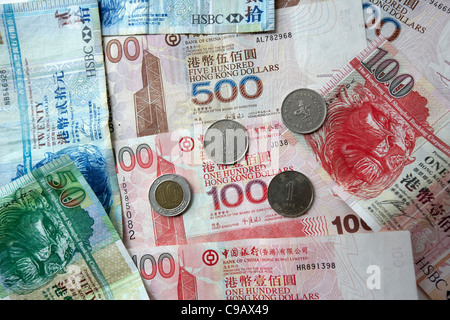 Dollari di Hong Kong di denaro contante le banconote e le monete in euro Foto Stock