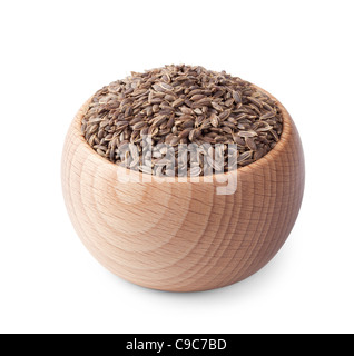 Ciotola di legno pieno di semi di aneto isolati su sfondo bianco Foto Stock