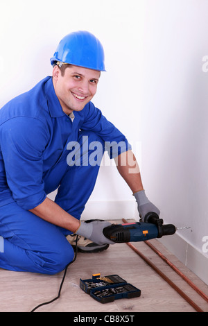 Uomo di perforazione Foto Stock