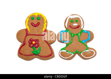 Colorato gingerbread uomo e donna su sfondo bianco Foto Stock