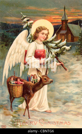 Christmas Angel con i cervi offrire doni Foto Stock