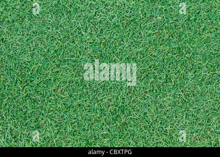 Texture di sfondo con finti erba in un pubblico Parco giochi per bambini, vista dall'alto Foto Stock