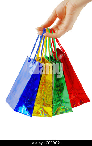 Colorata borse per lo shopping insieme in una donna canto isolato su bianco Foto Stock