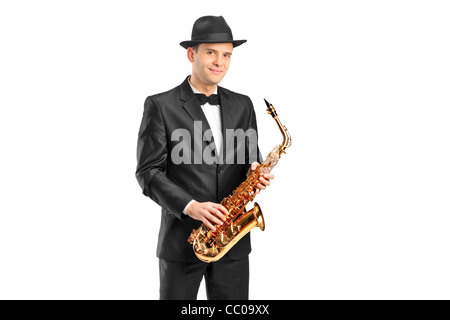 Un uomo in una tuta tenendo un sassofono Foto Stock