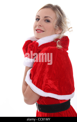 La bionda Miss Santa in un mini cape Foto Stock