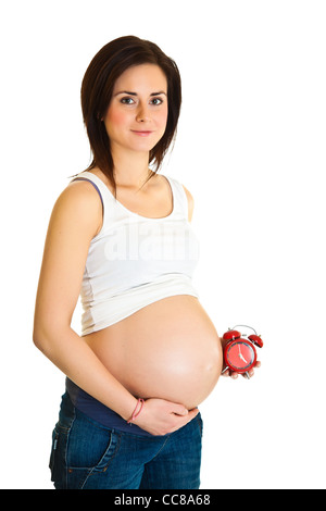 Donna incinta con un orologio, data di scadenza concept Foto Stock