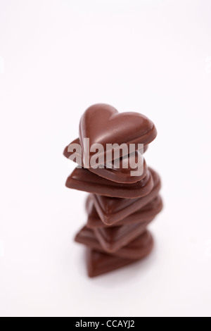 A forma di cuore ad cioccolatini in pila Foto Stock