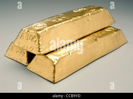 Barre di oro su sfondo grigio Foto Stock