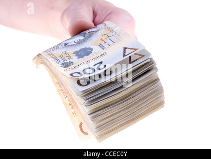 Pila di duecento zloty polacco in mano banconote isolati su sfondo bianco Foto Stock