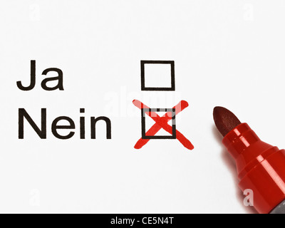 "No" in German is marked with a cross on a piece of paper. Beside is a red pen. Foto Stock
