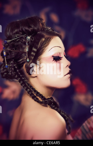 Immagine stilizzata di una geisha giapponese, il make-up svolto da professionisti artista polacco Foto Stock