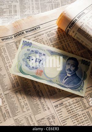 1.000 yen giapponese banconota sul quotidiano finanziario Foto Stock