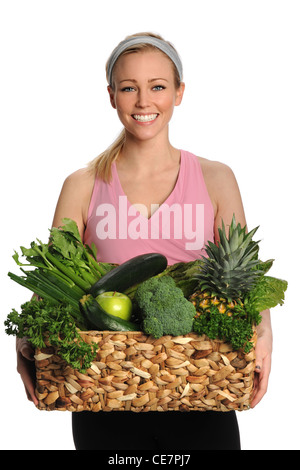 Ritratto di giovane e bella donna che mantiene la frutta e la verdura fresca isolate su sfondo bianco Foto Stock