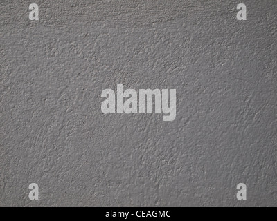 Textured caldo verniciato grigio interno muro di cemento. Foto Stock