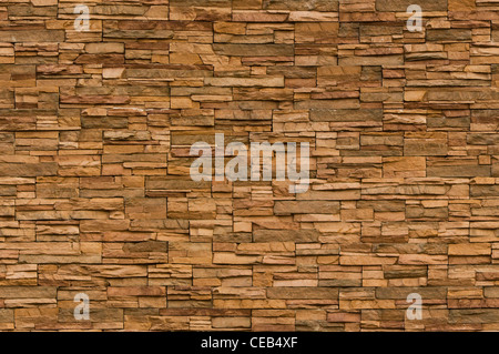 Dimensioni irregolari mattoni marrone con un organico di sentire. Immagine è perfettamente affiancabile Foto Stock