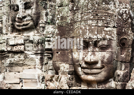 Facce di pietra in Avalokiteshvara, tempio Bayon Foto Stock