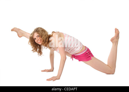 La ragazza di sportswear rende la ginnastica Foto Stock