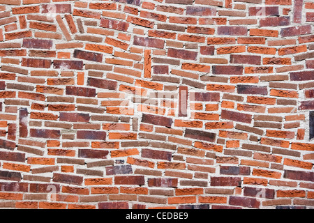 Parte del muro di pietra con il design in muratura di fantasia Foto Stock