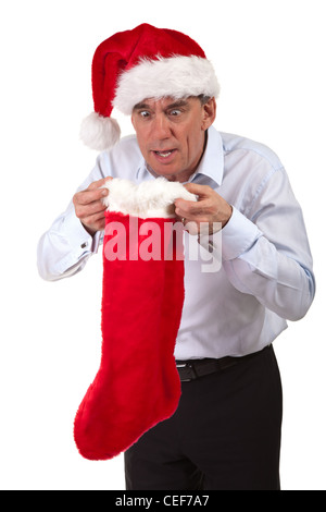 Business man in Santa Hat cercando sorpreso in calza di Natale Foto Stock