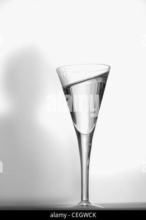 Silhouette e bicchiere di grappa Foto Stock