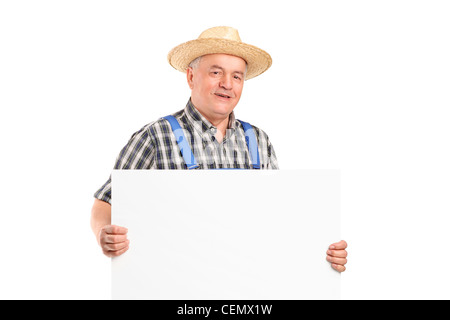 Una coppia sorridente l'agricoltore che detiene un banner isolati su sfondo bianco Foto Stock