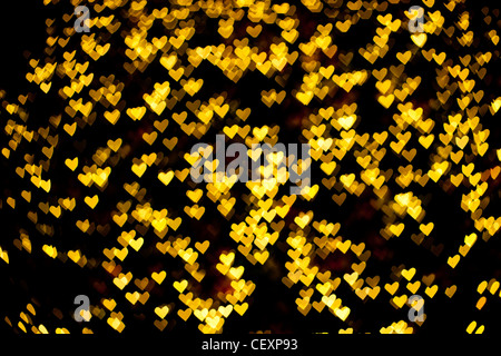 Sfocato di forma di cuore la luce di Natale, può essere utilizzato come sfondo Foto Stock