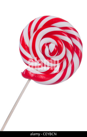 Bella lollipop con strisce rosse e bianche su sfondo bianco Foto Stock