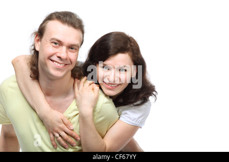 Ritratto di felice coppia giovane in amore, Ella ha abbracciato il fidanzato spalle dal retro Foto Stock