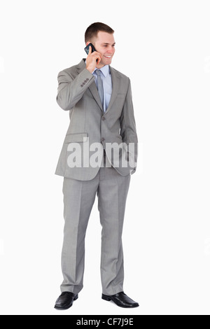 Imprenditore e permanente di telefonare Foto Stock