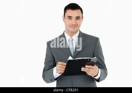 Imprenditore con appunti e penna Foto Stock