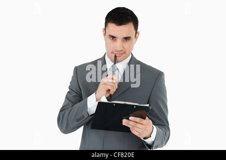 Imprenditore con penna e appunti Foto Stock