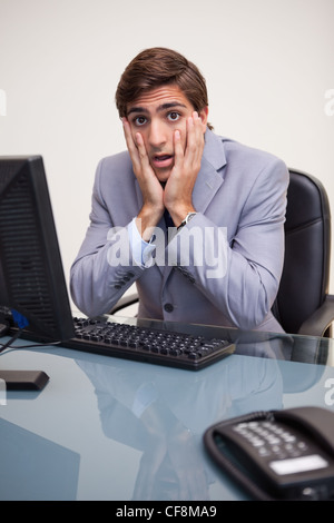 Businessman seems scared Foto Stock