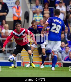 01.09.2012. Ipswich, Inghilterra. Lee Novak e Luca Camere in azione durante il FA campionato di gioco tra Ipswich Town e Huddersfield Town da Portman Road Foto Stock