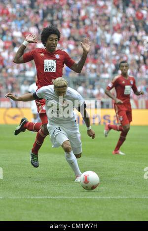 15.09.2012. Monaco di Baviera, Germania. FC Bayern Monaco di Baviera versus FSV Mainz 05 Dante Bonfim Costa Santos Monaco di Baviera e Marcel crepe Mainz Foto Stock