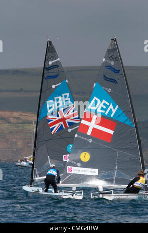 05.08.2012. Weymouth, Inghilterra. Giochi olimpici di vela a Weymouth Dorset, Agosto 2012. Tripla medaglia d'oro olimpica Ben Ainslie battaglie con la barca danese ma vince l'oro nella classe Finn. Foto Stock