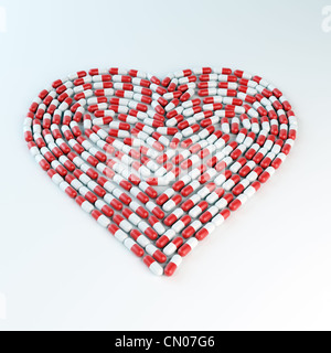 Rosso e bianco la formazione di capsule a forma di cuore - Concetto di cardiologia Foto Stock