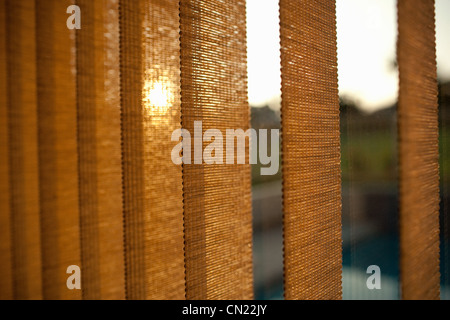 I ciechi della finestra al tramonto Foto Stock