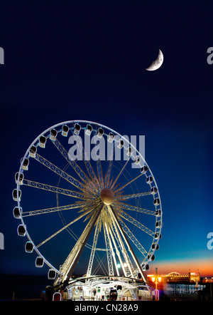 Brighton ruota,lungomare,Pier,tramonto.East Sussex,Inghilterra.UK Foto Stock