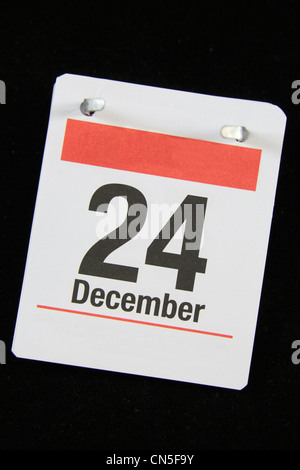 Piccola pagina calandra per la Vigilia di Natale, 24 Dicembre su uno sfondo nero. Foto Stock