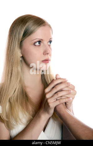 La ragazza tiene le due mani una mano d'uomo su sfondo bianco Foto Stock