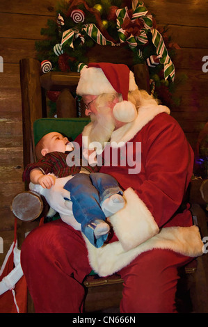 Illustrazione di otto mesi Baby Boy con Babbo Natale Foto Stock